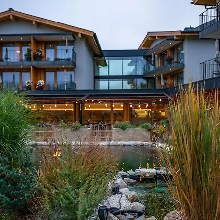 Wellness Und Brunch Morgenzeit Beheizter Naturpool Mit Sandstrand Genuss Fruehstueck Bis 13 Uhr Hochkoenig Sommercard Hotel Maria Alm am Steinernen Meer